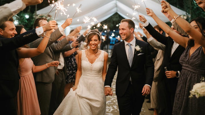 Newlyweds making their grand entrance as guests cheer