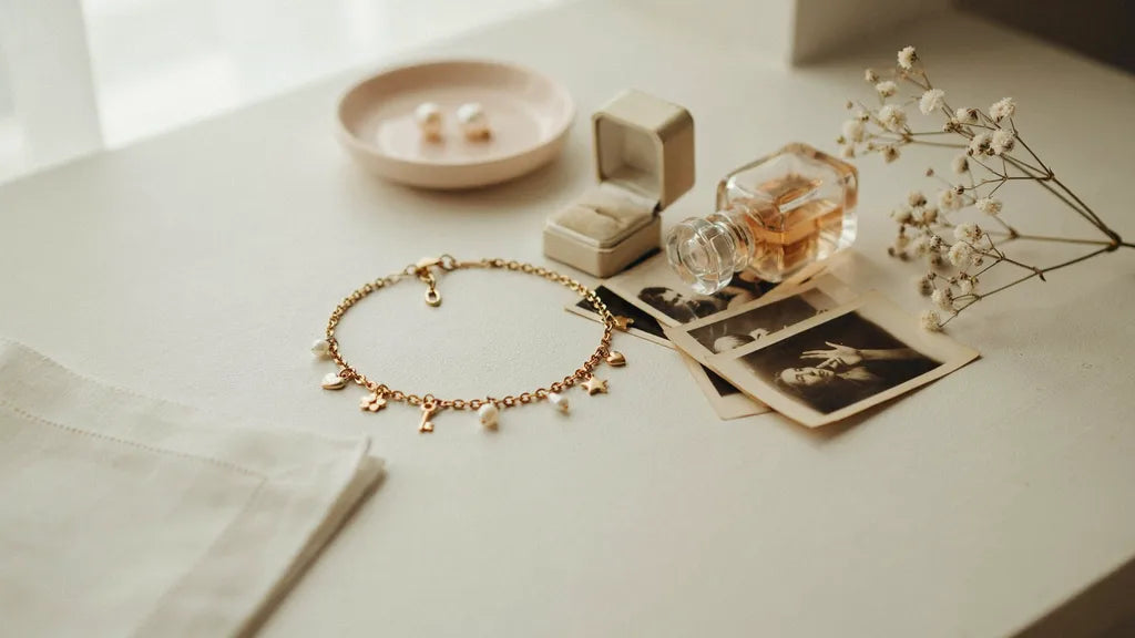 A charm bracelet and photo-booth strips on a vanity — custom songs for your daughter | Songbond