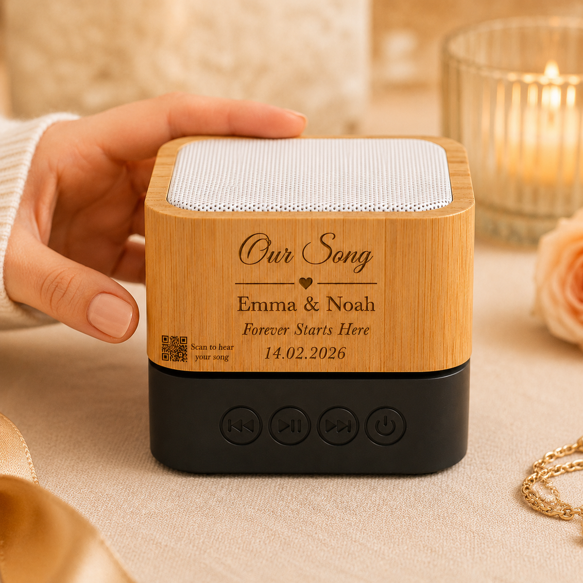 The Custom Song Soundbox held in one hand, showing its size