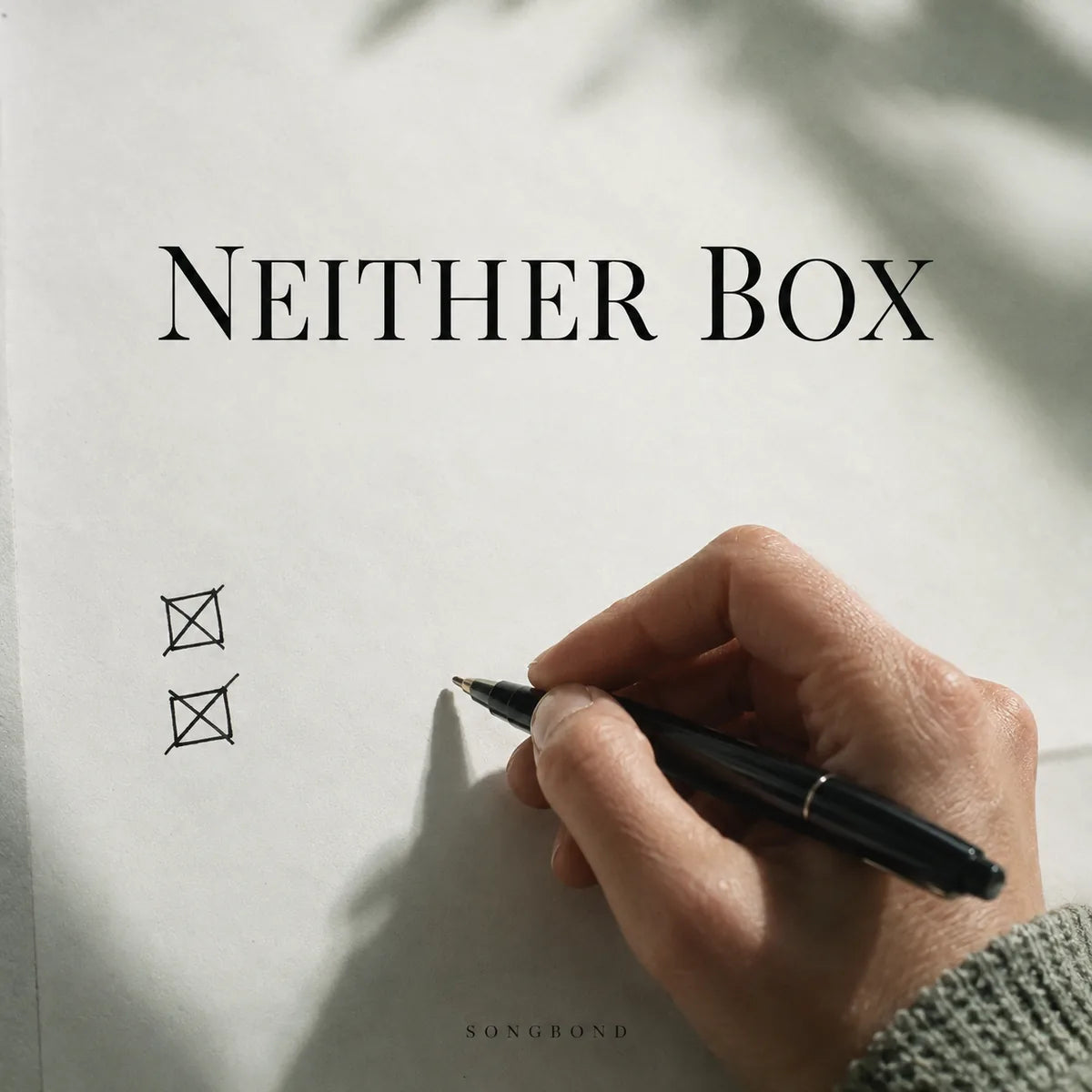 Music cover for Neither Box by Songbond, with a hand holding a pen beside two crossed-out checkboxes on a plain pale page beneath black title lettering.
