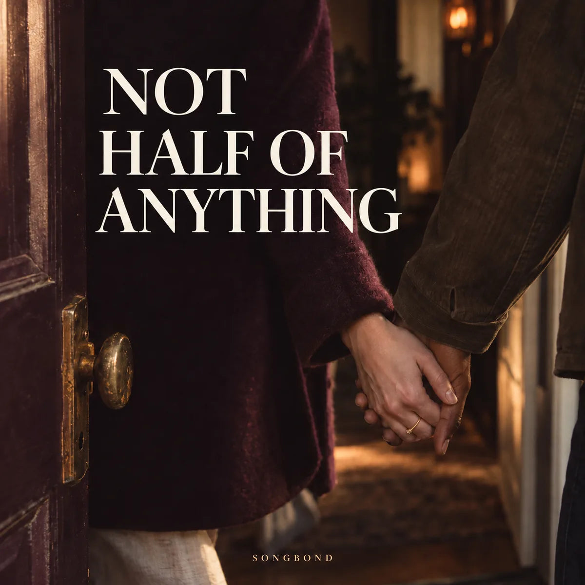 Music cover for Not Half of Anything by Songbond, with two people's joined hands in a warmly lit doorway and large cream lettering against a burgundy coat.