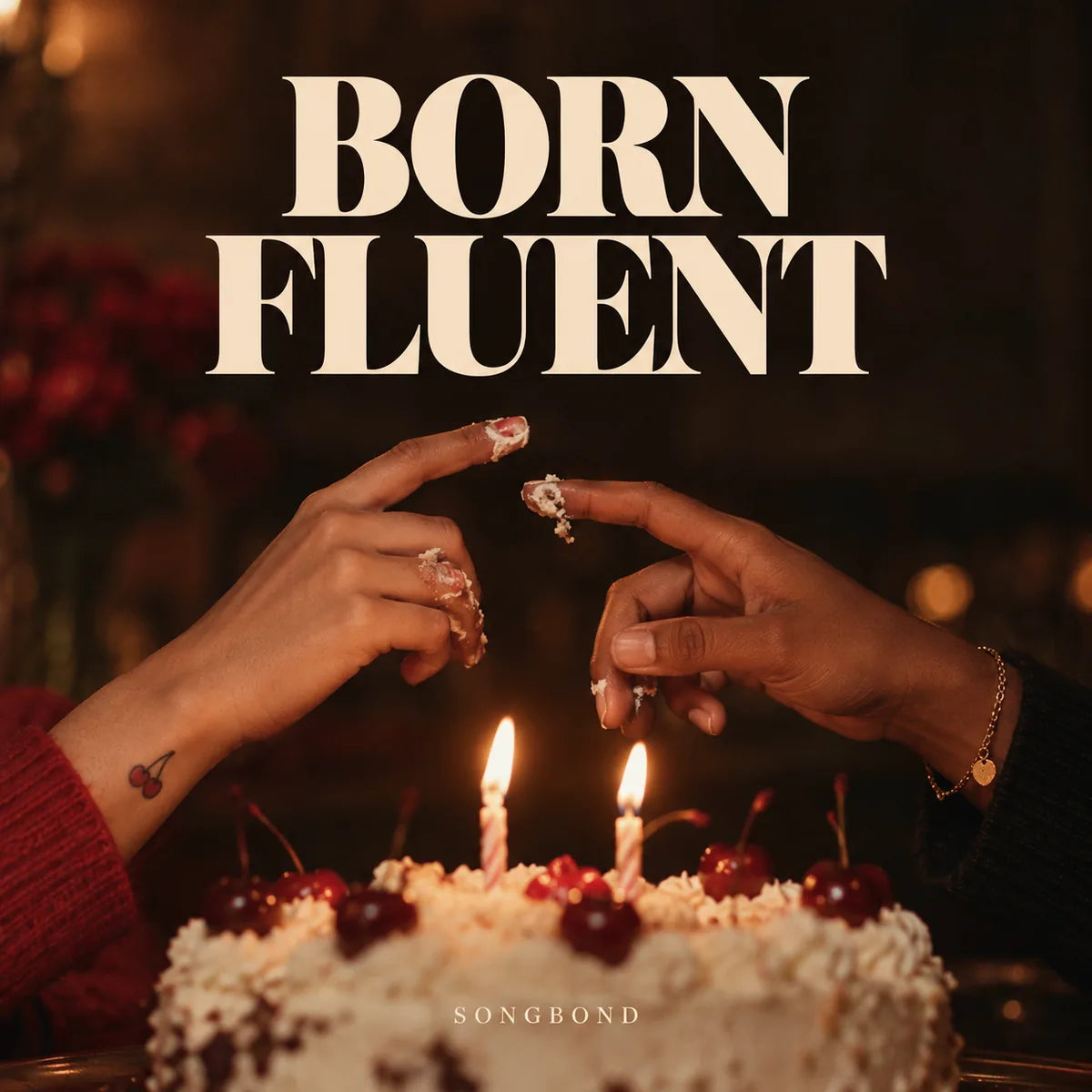 Music cover for Born Fluent by Songbond, with two hands above a shared cake and two candle flames beneath large cream lettering.