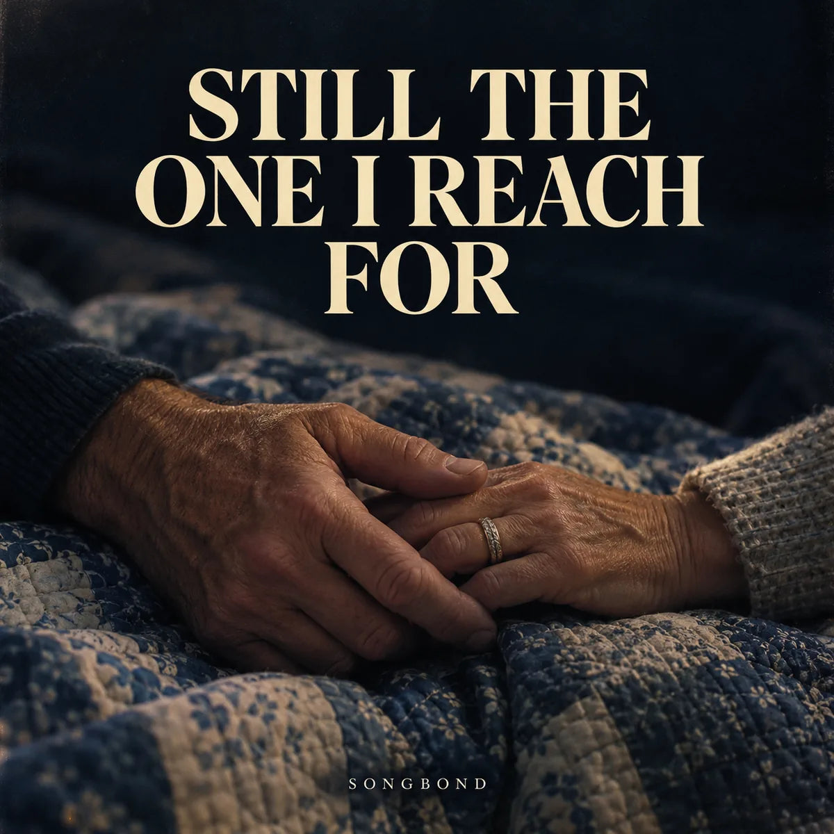 Music cover for Still the One I Reach For by Songbond, with two mature hands touching over a worn blue quilt beneath the complete cream title.