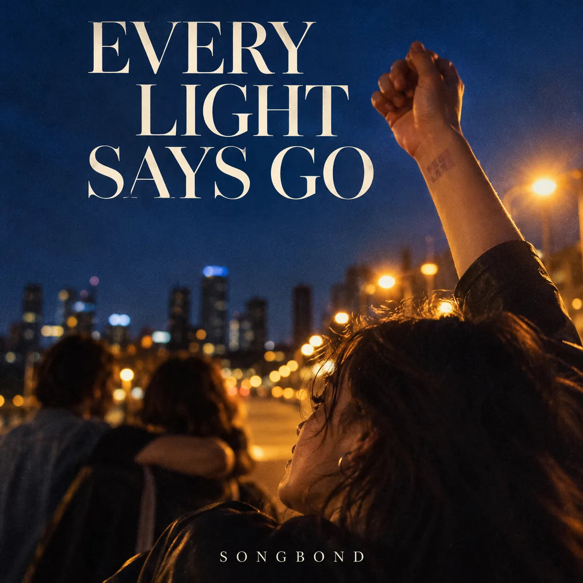 Music cover for Every Light Says Go: a young adult raises a wrist in cobalt evening light with softly blurred friends and amber streetlights beneath the full cream title.
