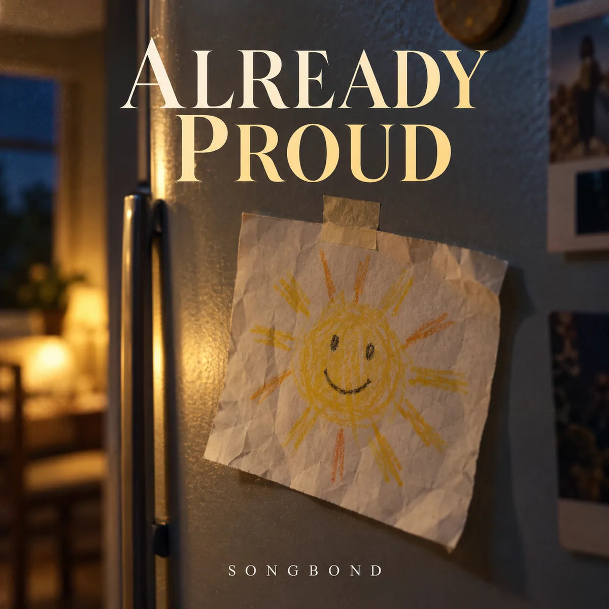 Music cover for Already Proud: a crooked crayon sun drawing is taped to a home refrigerator in warm evening light beneath the large cream title.